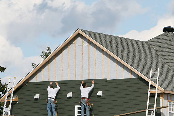 Professional Siding technician working in Glen Cove, NY